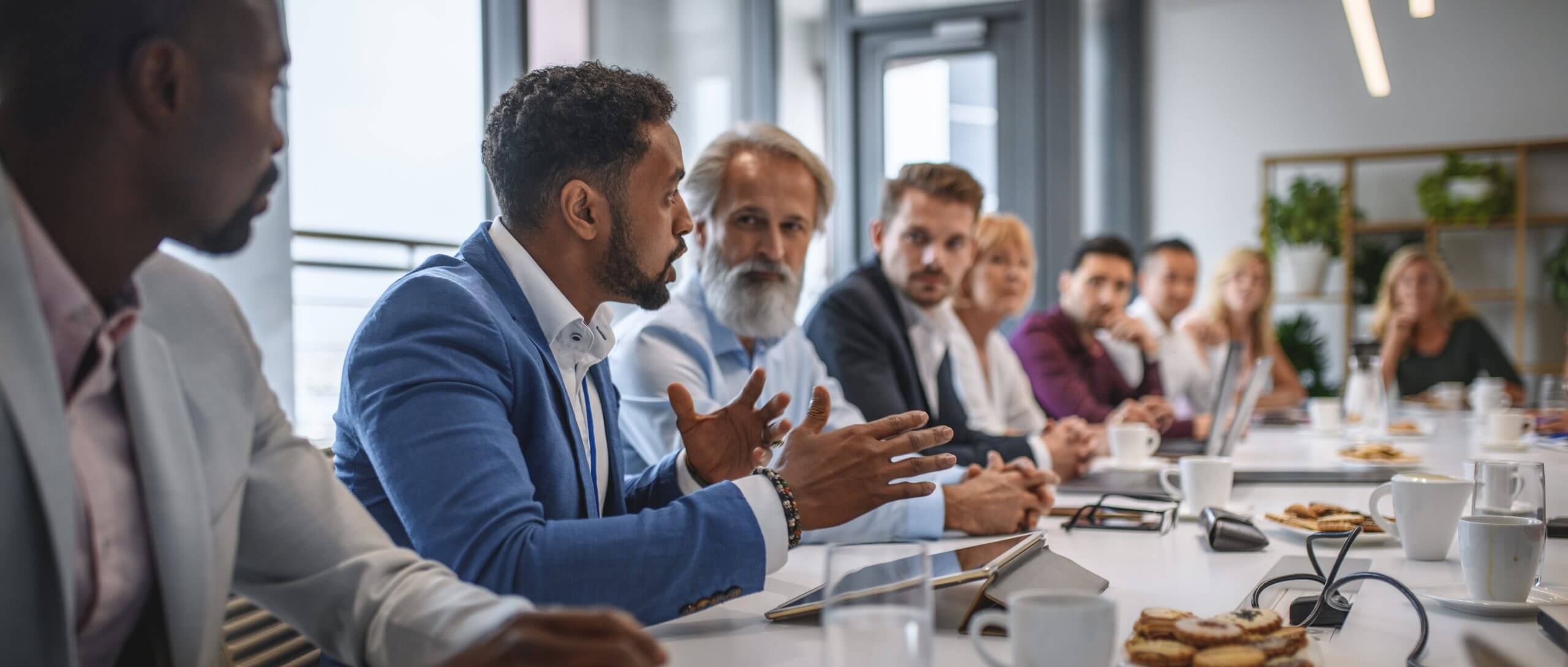 Business meeting around a conference table.